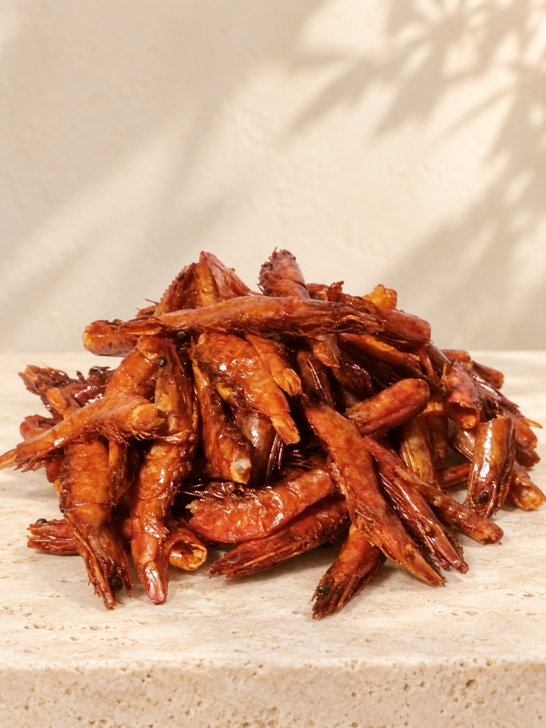 Whole dried Oporo giant prawns on a cream travertine surface
