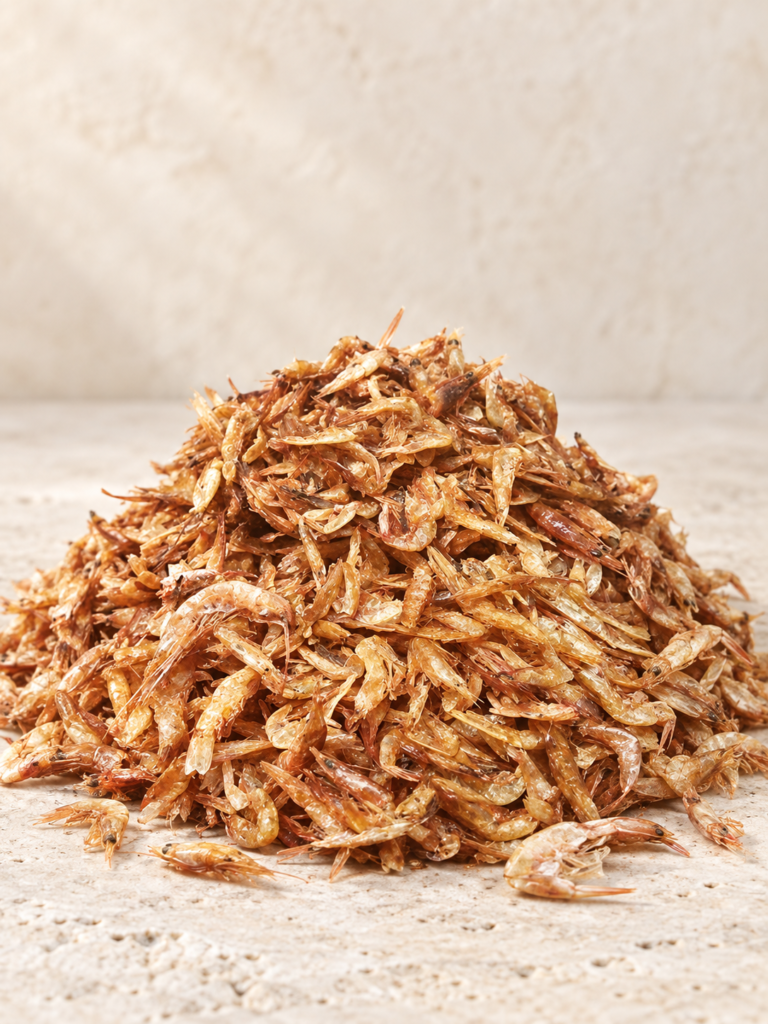 Pile of sun-dried crayfish on a light neutral background